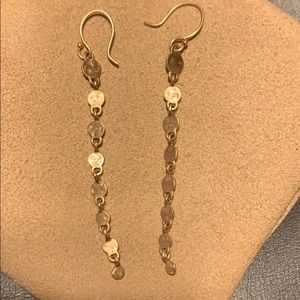 Me&Ro gold skull earrings.